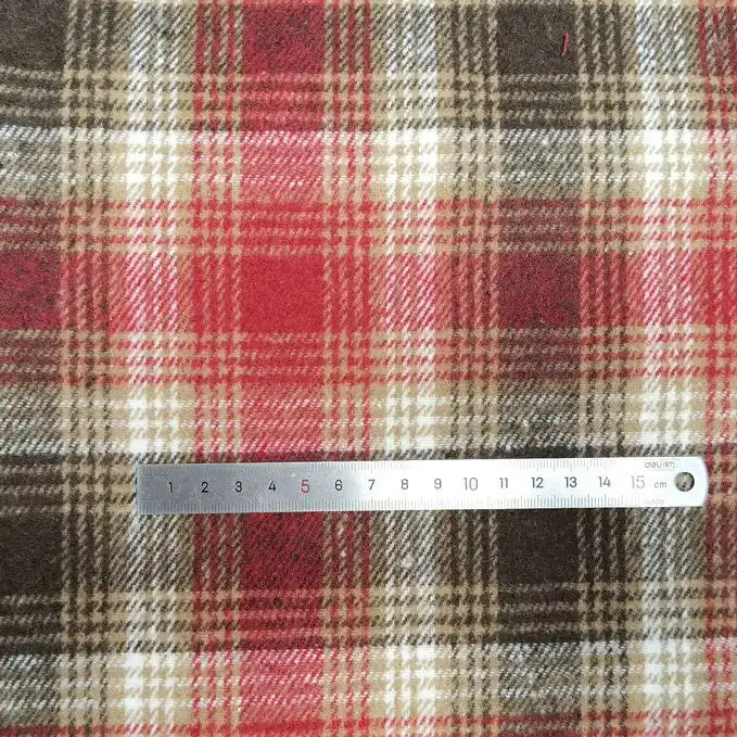 A 20 cm metal ruler rests on Longan Craft's Plaid Brushed Mammoth Flannel Fabric, showcasing the scale and vibrant plaid pattern of this colorful polyester-cotton fall material.