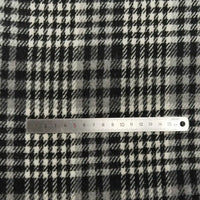 A metal ruler measuring 1–15 cm is placed on Longan Craft's Plaid Brushed Mammoth Flannel Fabric By The Yard, a comfy, colorful polyester cotton flannel—ideal material for fall projects.