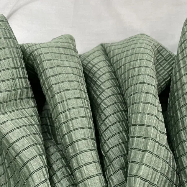 A close-up of Longan Craft’s Plaid Jacquard Lyocell Fabric By The Yard shows its multicolor checked pattern and soft, breathable lyocell textile—ideal for apparel and sustainable projects.