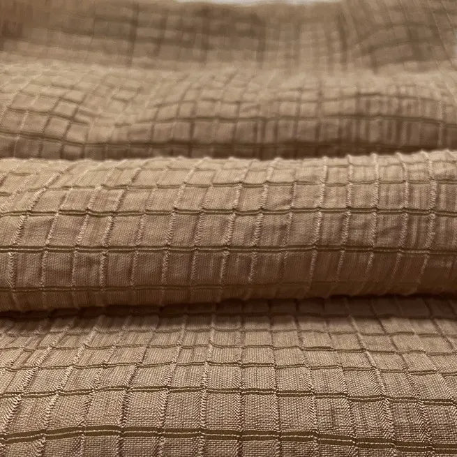 Close-up of Longan Craft’s Plaid Jacquard Lyocell Fabric By The Yard, showing its raised multicolor checked pattern and soft, breathable texture—ideal sustainable material for apparel.