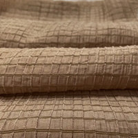 Close-up of Longan Craft’s Plaid Jacquard Lyocell Fabric By The Yard, showing its raised multicolor checked pattern and soft, breathable texture—ideal sustainable material for apparel.