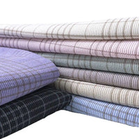 A selection of Longan Craft’s Plaid Print 16 Wale Corduroy Fabric by the yard, featuring colorful fine wale printed corduroy material ideal for pants, neatly arranged against a white background.