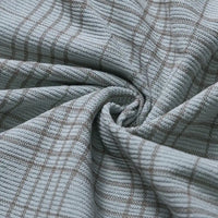 Soft 16-wale corduroy fabric from Longan Craft, featuring a light blue base with a brown plaid print and ribbed texture. The Plaid Print 16 Wale Corduroy Fabric By The Yard is gathered at the center to showcase its gentle folds and plush surface, making it ideal for pants and other premium projects.