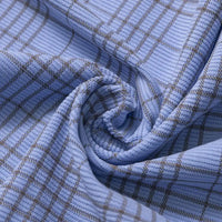 Close-up of Longan Craft’s Plaid Print 16 Wale Corduroy Fabric By The Yard, featuring colorful fine wale ribbing and a subtle plaid grid in light brown on light blue. This premium corduroy material is softly twisted to showcase its textured surface and flexible drape—ideal for crafting stylish pants.