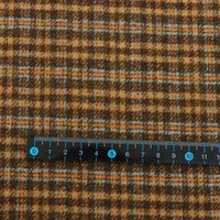 Plaid Wool Fabric By The Yard in brown, orange, and blue brushed plaid, shown with a ruler for scale.