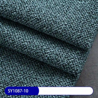 Close-up of folded Plain Color Boucle Fabric By The Yard by Longan Craft in dark teal, showing its looped, textured surface. Ideal for drapery or upholstery. A SY1087-10 label is visible at the bottom in white on blue.