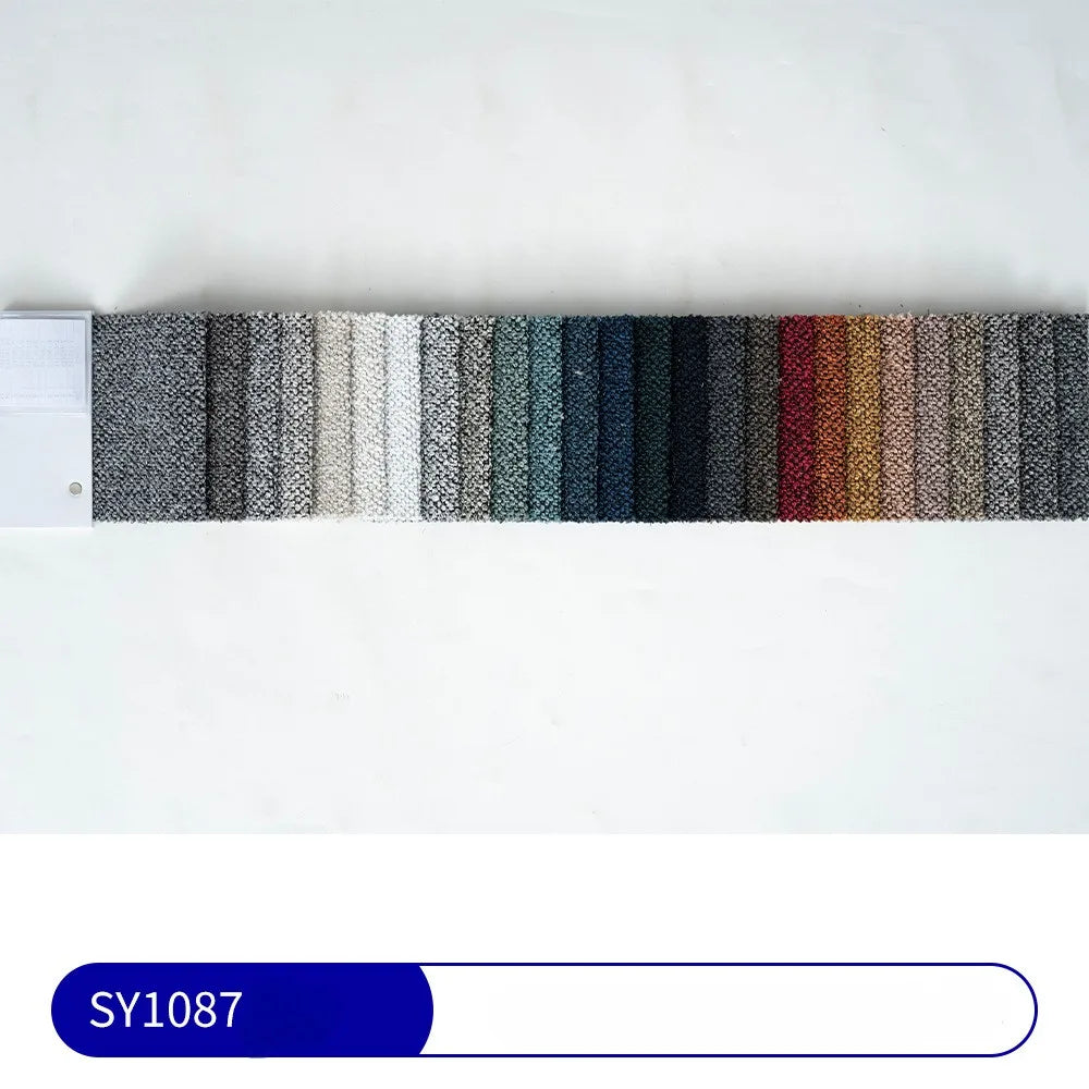 The Longan Craft swatch book displays 24 samples of "Plain Color Boucle Fabric By The Yard," featuring thick polyester boucle upholstery material in a color gradient, with a blue-and-white SY1087 label below.