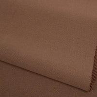 A close-up of Longan Craft's Plain Color French Terry Fabric by the yard, crafted from soft polyester with a subtle woven texture, shown neatly folded in layers—ideal for winter clothing.