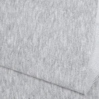 Close-up of Longan Craft's Plain Color French Terry Fabric By The Yard, made of soft heathered polyester with a smooth front and slightly textured underside—ideal for cozy winter clothing.