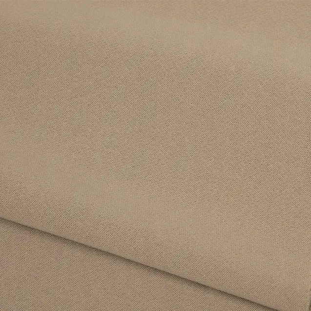 A close-up of the Plain Color French Terry Fabric By The Yard from Longan Craft shows its light brown, textured polyester material, neatly folded to reveal the weave and soft surface—ideal for winter clothing.
