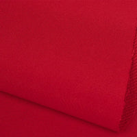 A close-up of two overlapping pieces of Plain Color French Terry Fabric by Longan Craft, featuring a smooth and slightly textured bright red surface, ideal soft polyester material for winter clothing.