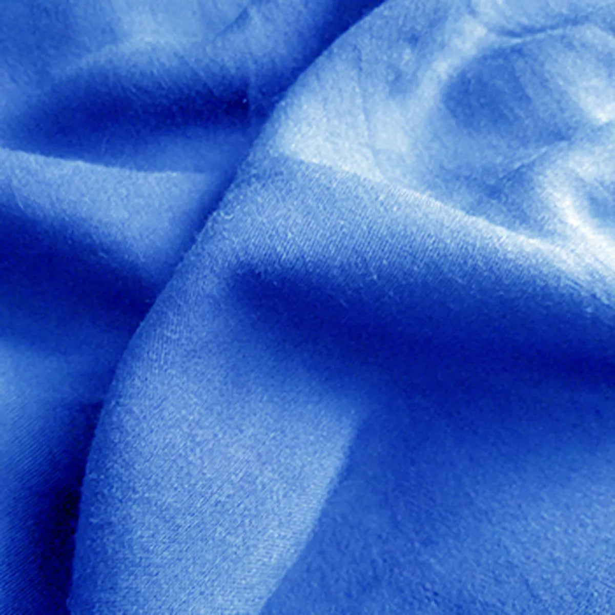 Close-up of Longan Craft's Plain Color Jersey Viscose Fabric—100% rayon viscose by the yard. This smooth, lightweight, and slightly shiny material is perfect for dresses with its soft, flowing drape and gentle folds.