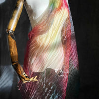 A mannequin displays Longan Craft’s Gradient Pleated Organza Fabric By The Yard, featuring a shiny finish in red, yellow, and green hues—ideal for wedding gowns and perfectly capturing elegant modern bridal style.