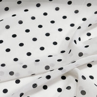 Polka Dot Print Chiffon Fabric By The Yard featuring a sheer white chiffon base with a black polka dot pattern.