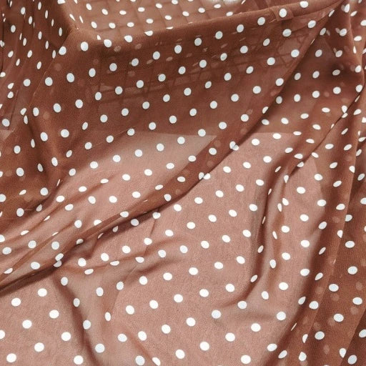 Polka Dot Print Chiffon Fabric By The Yard in sheer brown, draped in soft, elegant folds.