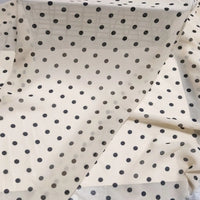 Polka Dot Print Chiffon Fabric By The Yard featuring sheer off-white chiffon with a repeating black polka dot print.