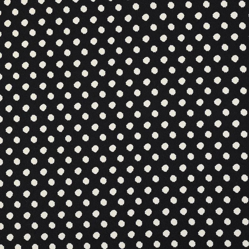 Longan Craft’s Polka Dot Print Corduroy Fabric by the Yard is a fine wale corduroy material featuring a retro dotted pattern of evenly spaced white polka dots arranged in rows and columns on a black background.