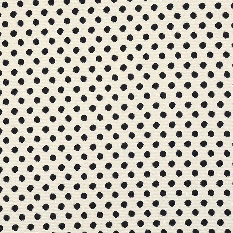 The Longan Craft Polka Dot Print Corduroy Fabric By The Yard features a fine wale corduroy material with evenly spaced black polka dots arranged in a diagonal pattern on a cream background, offering a retro-inspired textile perfect for chic and stylish projects.
