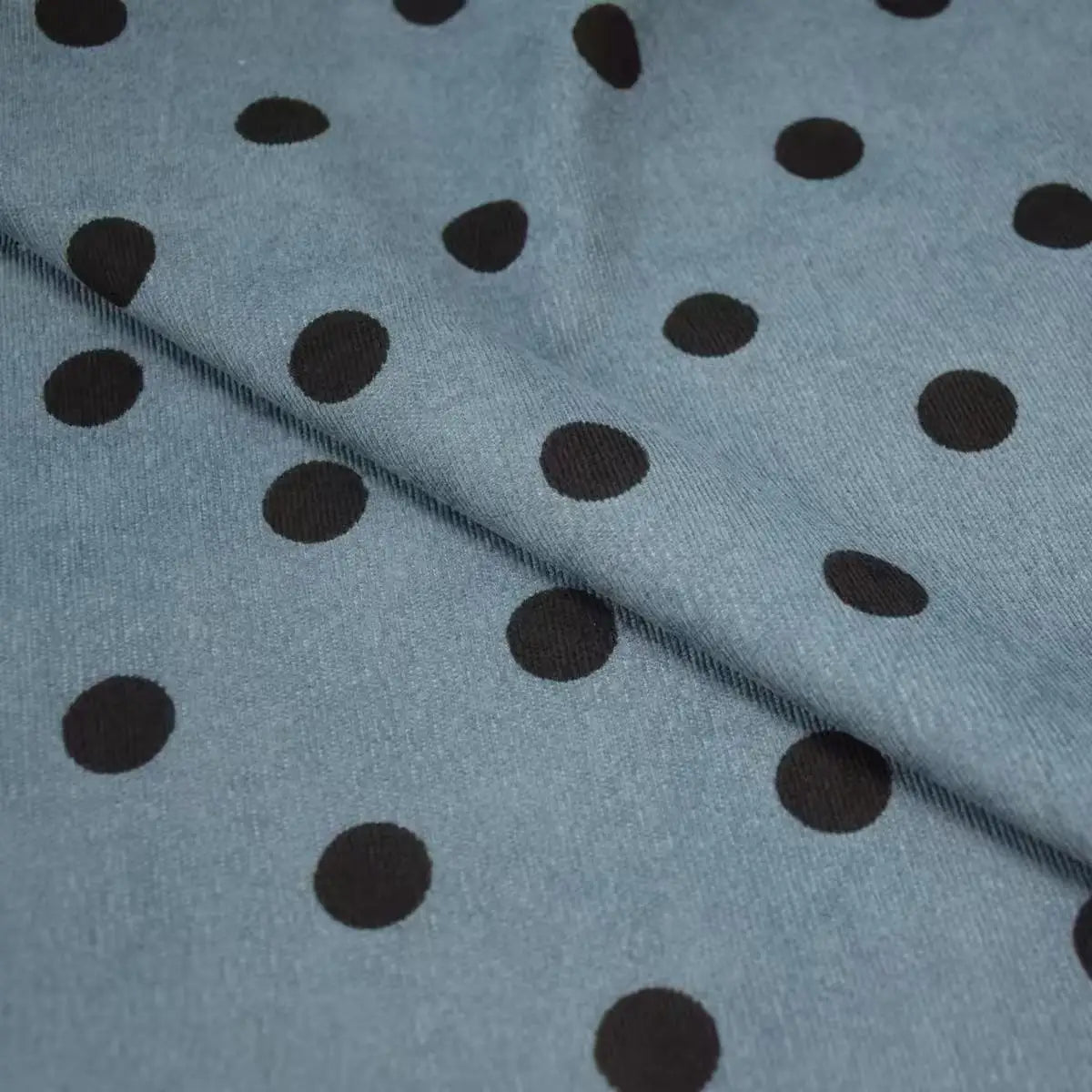 Polka Dot Printed 21 Wales Corduroy Fabric By The Yard in blue with a black polka dot pattern folded over itself.