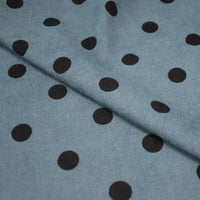 Polka Dot Printed 21 Wales Corduroy Fabric By The Yard in blue with a black polka dot pattern folded over itself.