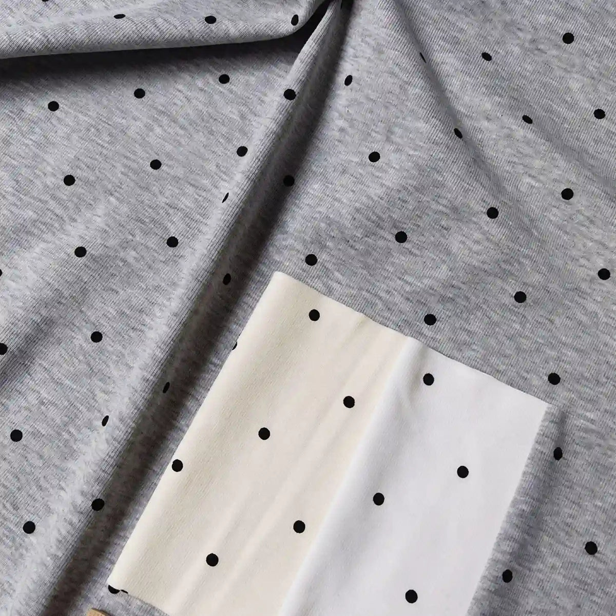 Polka Dot Printed Cotton 1*1 Rib Knit Fabric By The Yard in gray, cream, and white with a black polka dot rib knit pattern.