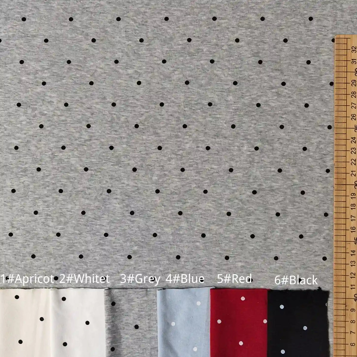 Grey polka dot Polka Dot Printed Cotton 1*1 Rib Knit Fabric By The Yard shown next to a measuring tape, with fabric swatches in white, grey, blue, red, and black labeled at the bottom.