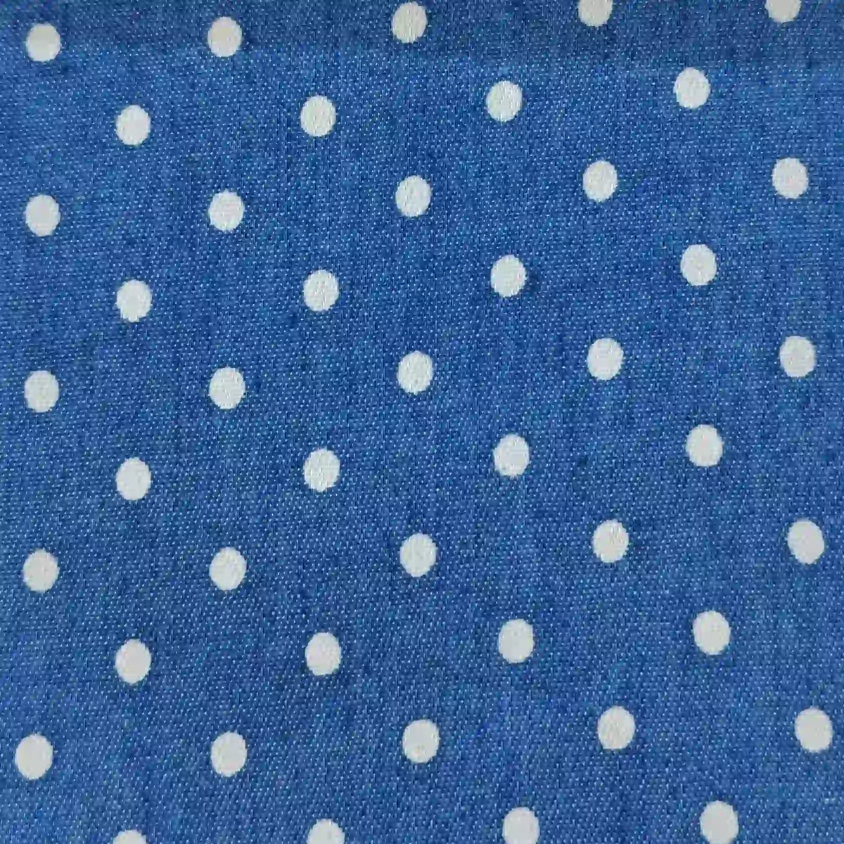 Polka Dot Printed Denim Fabric By The Yard featuring a blue denim material with a white polka dot print.