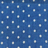 Polka Dot Printed Denim Fabric By The Yard featuring a blue denim material with a white polka dot print.