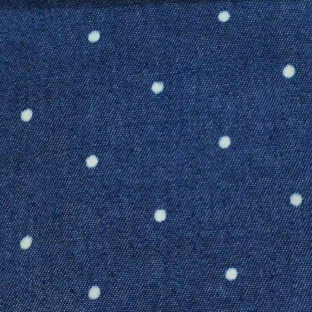 Polka Dot Printed Denim Fabric By The Yard in dark blue with a white polka dot pattern.