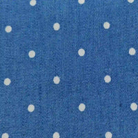 Polka Dot Printed Denim Fabric By The Yard featuring blue denim with a white polka dot pattern.