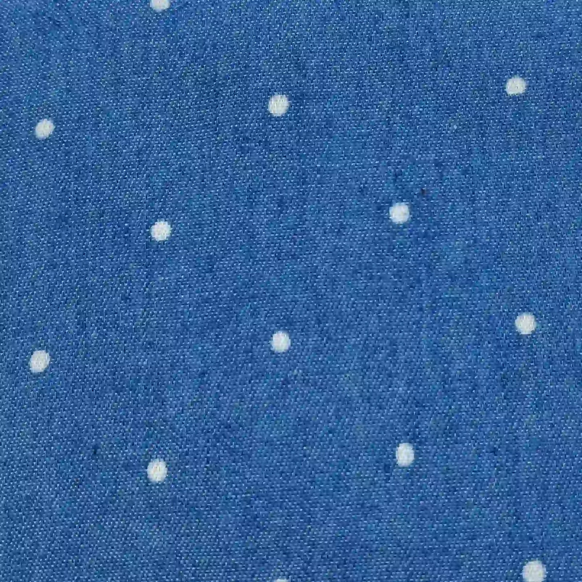 Polka Dot Printed Denim Fabric By The Yard in blue with a pattern of small white polka dots.