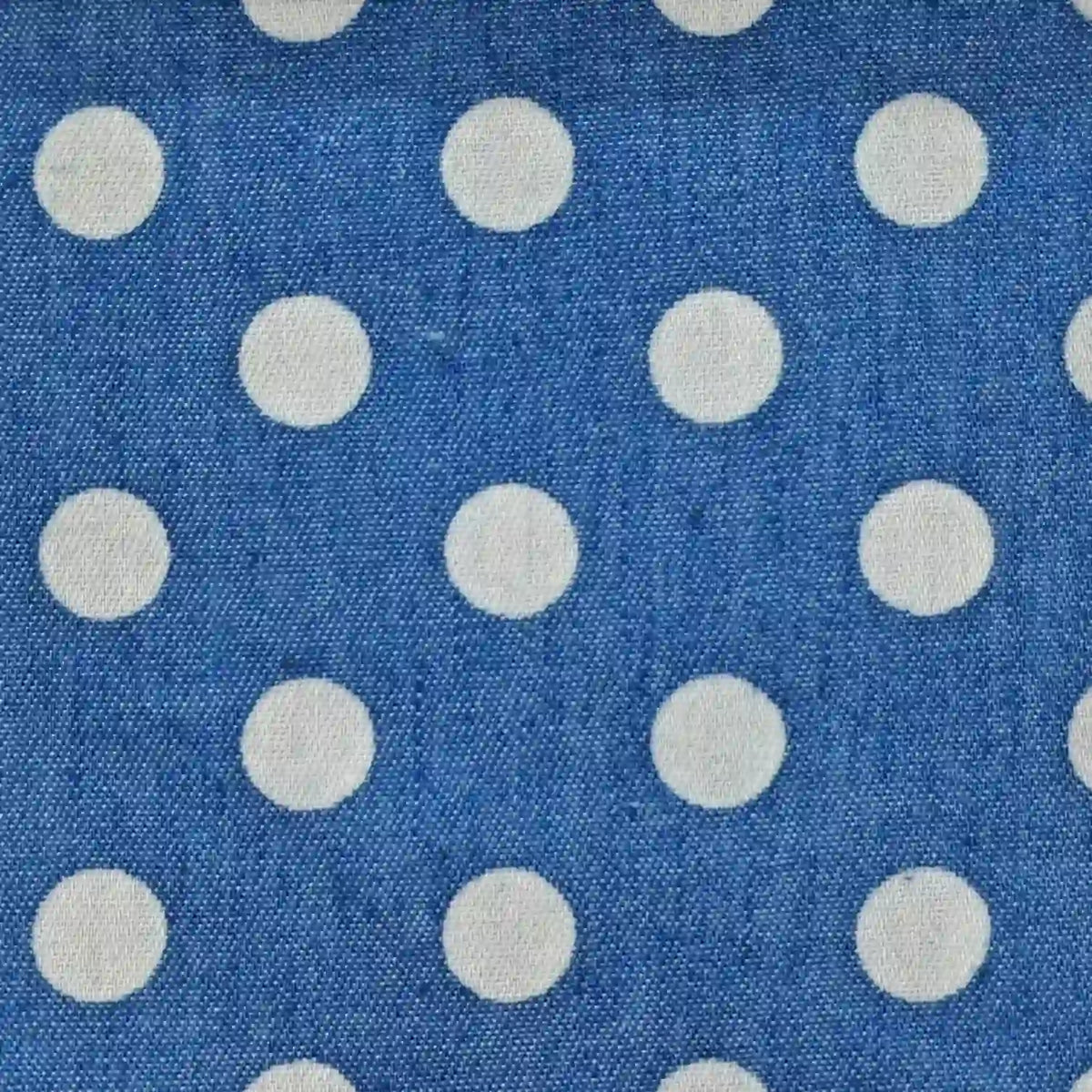 Polka Dot Printed Denim Fabric By The Yard in blue with a white polka dot pattern.