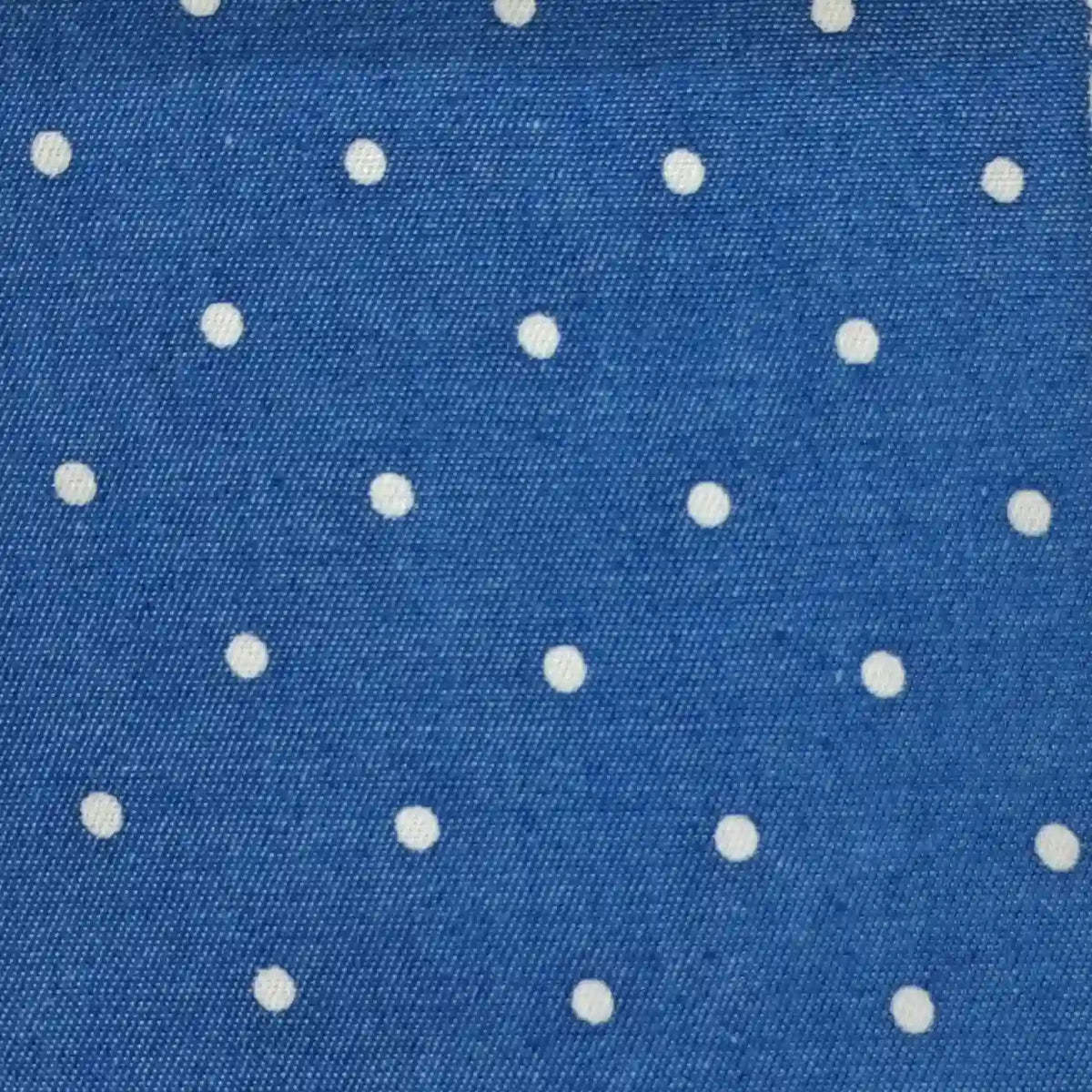 Polka Dot Printed Denim Fabric By The Yard in blue with a white polka dot pattern.
