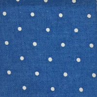 Polka Dot Printed Denim Fabric By The Yard in blue with a white polka dot pattern.