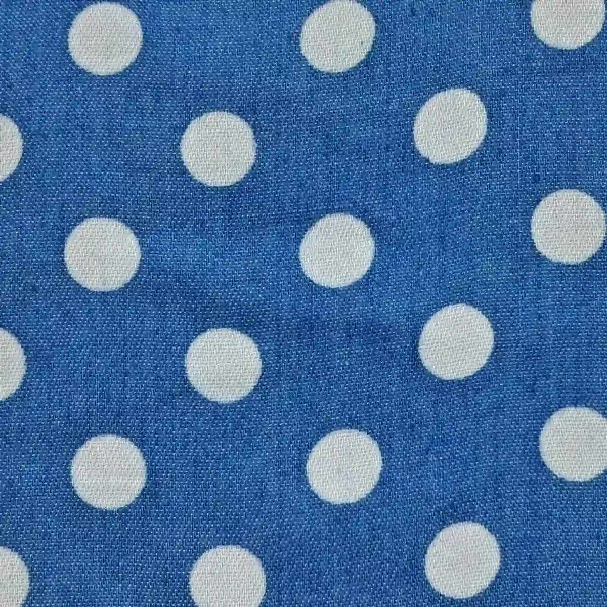 Polka Dot Printed Denim Fabric By The Yard in blue with a white polka dot print.