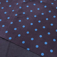 Polka Dot Printed Faux Suede Fabric By The Yard in dark faux suede featuring a repeating pattern of light blue polka dots.