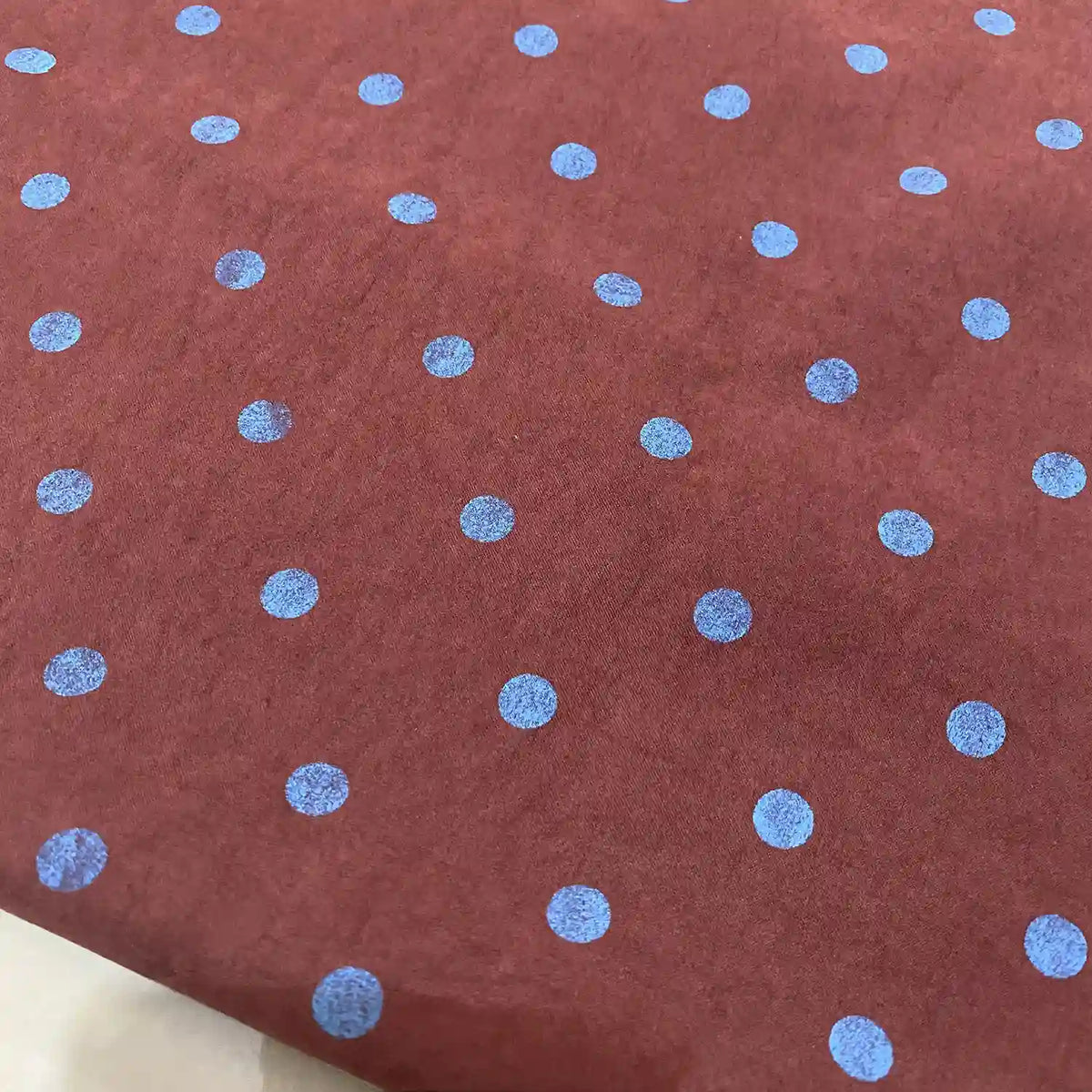 Brown Polka Dot Printed Faux Suede Fabric By The Yard featuring a blue polka dot pattern.