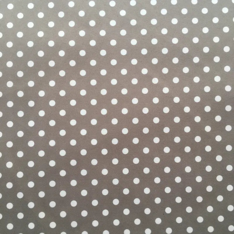 Longan Craft's Polka Dot Printed Peachskin Fabric features a gray background with small white polka dots, made from soft microfiber polyester. Ideal for DIY skirts, it offers a smooth peachskin texture and is sold by the yard.