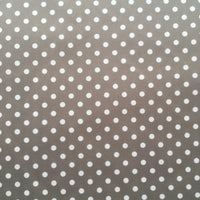 Longan Craft's Polka Dot Printed Peachskin Fabric features a gray background with small white polka dots, made from soft microfiber polyester. Ideal for DIY skirts, it offers a smooth peachskin texture and is sold by the yard.