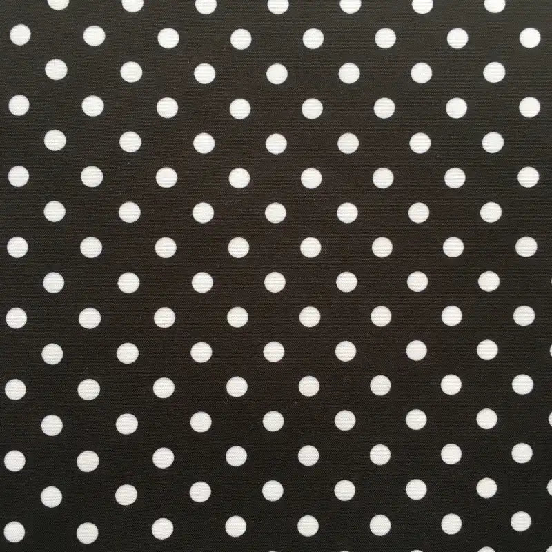 The Longan Craft Polka Dot Printed Peachskin Fabric by the yard features a black background with evenly spaced white polka dots, made from soft microfiber polyester—perfect for DIY skirts and stylish projects.