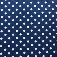 Longan Craft's Polka Dot Printed Peachskin Fabric By The Yard features a navy blue background with evenly spaced white dots, made from colorful microfiber polyester with a soft texture—perfect for creating stylish DIY skirts and garments.