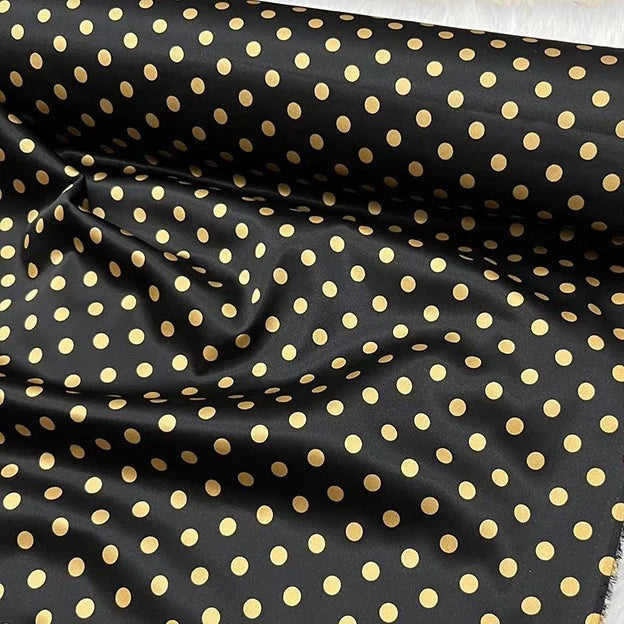 Longan Craft's Polka Dot Stretch Silk Fabric By The Yard, 19 Momme spandex printed silk, features small gold dots on black—ideal for vintage clothing, chic bridal wear, or elegant evening gowns.