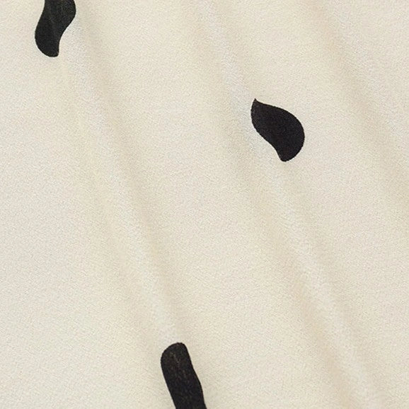 Longan Craft’s Polka Dot and Floral Printed Viscose Fabric By The Yard features fashionable 100% viscose with bold black polka dots, perfect for creating contemporary long skirts or stylish dressmaking projects.