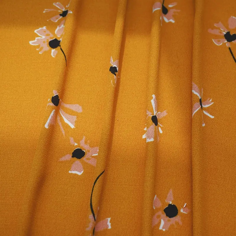 Longan Craft’s Polka Dot and Floral Printed Viscose Fabric features a 100% viscose print with scattered blooms and polka dots—ideal for long skirts, dresses, and fashion projects. Available by the yard for all your dressmaking needs.