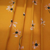 Longan Craft’s Polka Dot and Floral Printed Viscose Fabric features a 100% viscose print with scattered blooms and polka dots—ideal for long skirts, dresses, and fashion projects. Available by the yard for all your dressmaking needs.