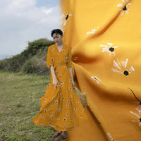 A woman stands outdoors in a long skirt made from Longan Craft’s Polka Dot and Floral Printed Viscose Fabric by the yard, shown with a close-up of the soft, vibrant 100% viscose material—ideal for fashionable skirts and dresses.