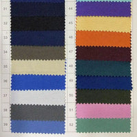 A chart displays 22 Longan Craft Polyester Gabardine Fabric swatches (31–52) in two columns, featuring premium twill fabric by the yard for jackets in solid shades like blue, black, yellow, orange, green, gray, purple, pink, and white.