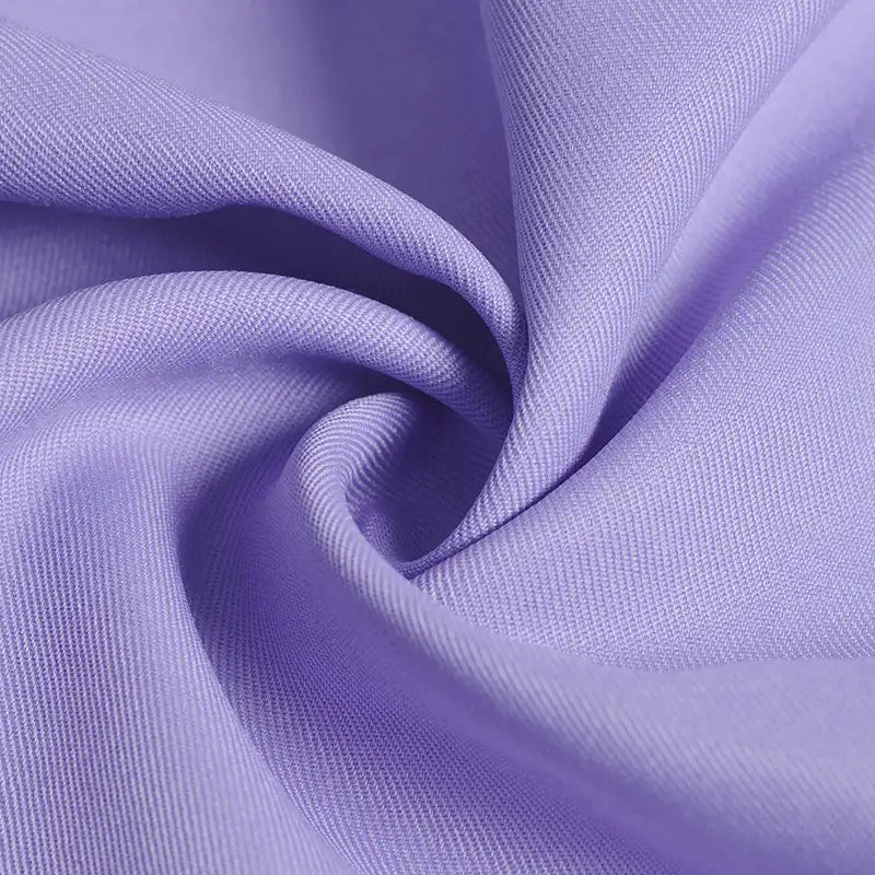 Close-up of Longan Craft Polyester Gabardine Fabric By The Yard, showing its smooth, soft texture and twill weave. This premium plain color gabardine is ideal for stylish jackets and features a gentle sheen and wrinkle resistance.