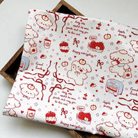 Puppy Apple Print Canvas Fabric By The Yard featuring white cotton fabric with a red line-art pattern of puppies, apples, hearts, and the text Happy everyday and May the world be more gentle.