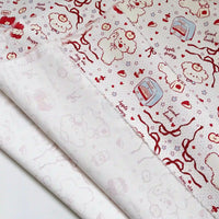 Puppy Apple Print Canvas Fabric By The Yard in white cotton canvas with a red line-art print of puppies, apples, small toasters, ribbons, and text reading Apple puppy and Good luck.